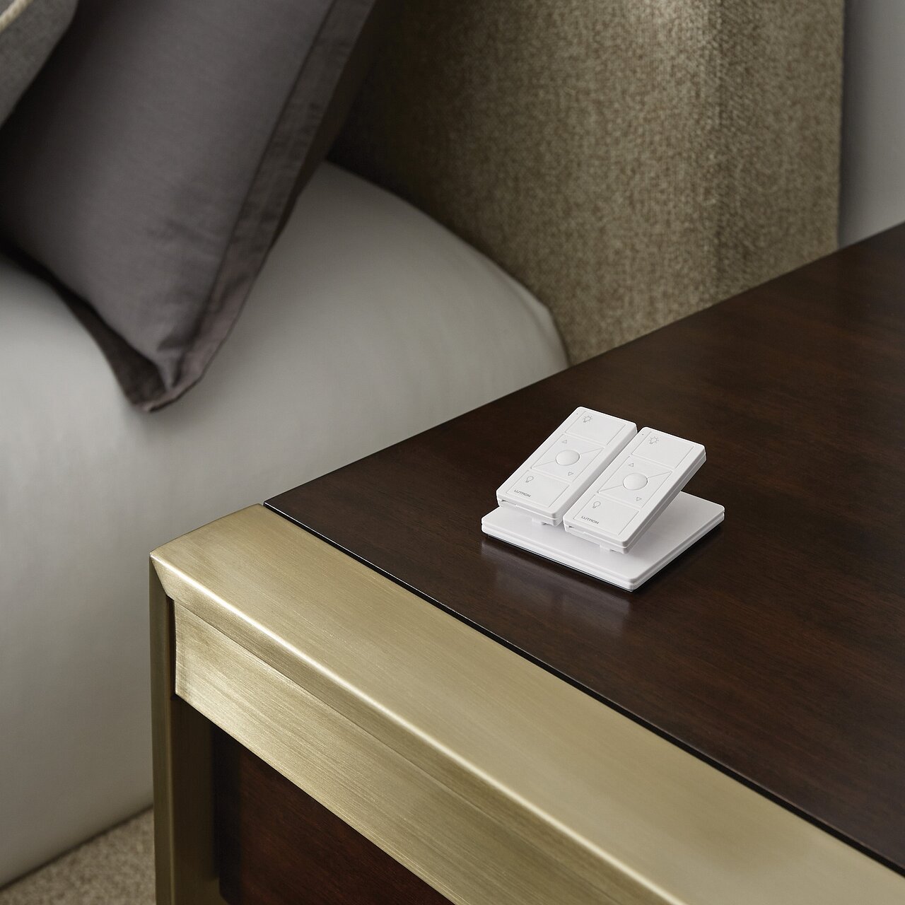 Lutron Pico wireless remote controls on a bedside table