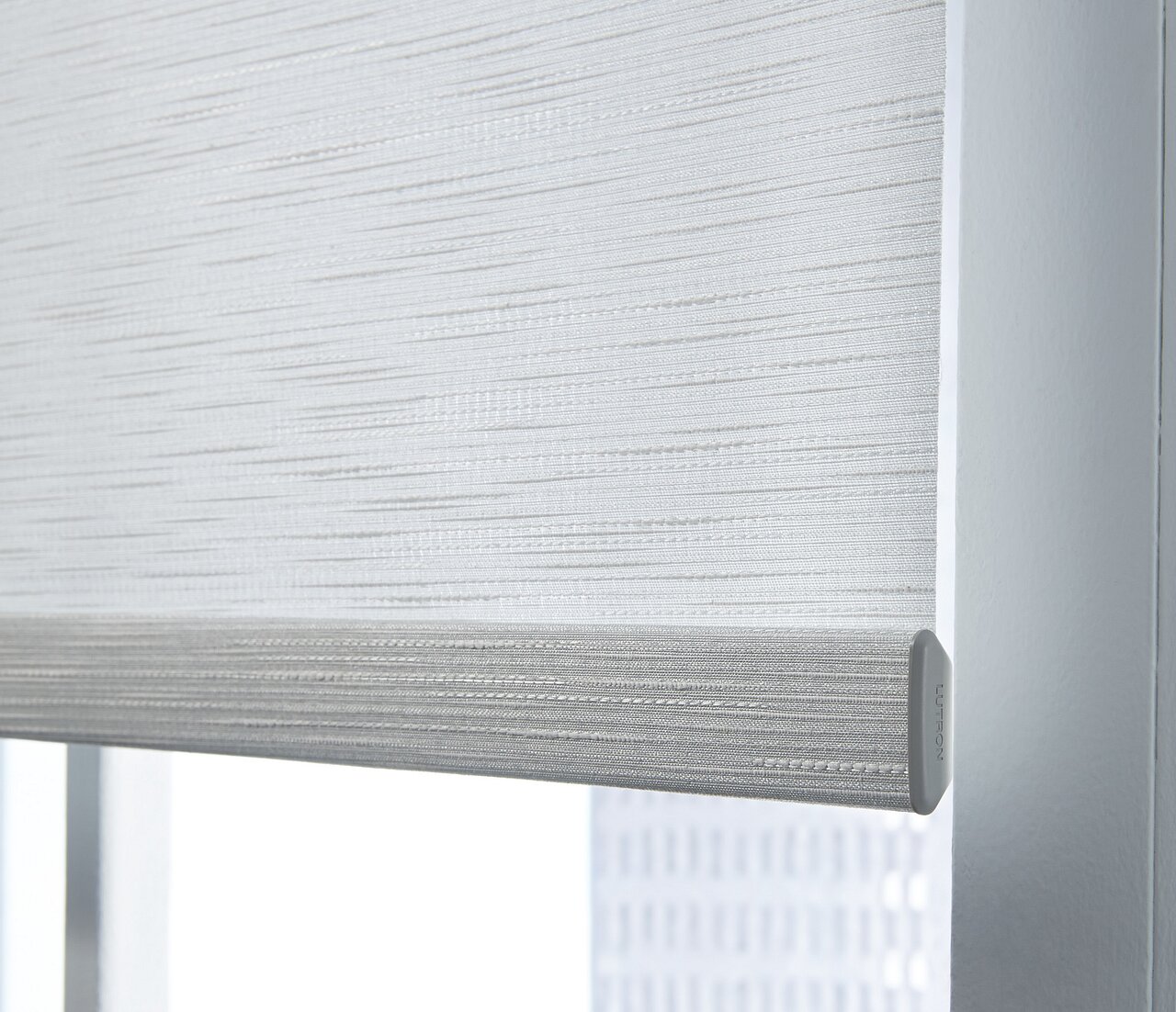 Detail of a Lutron shade hembar and finished edge