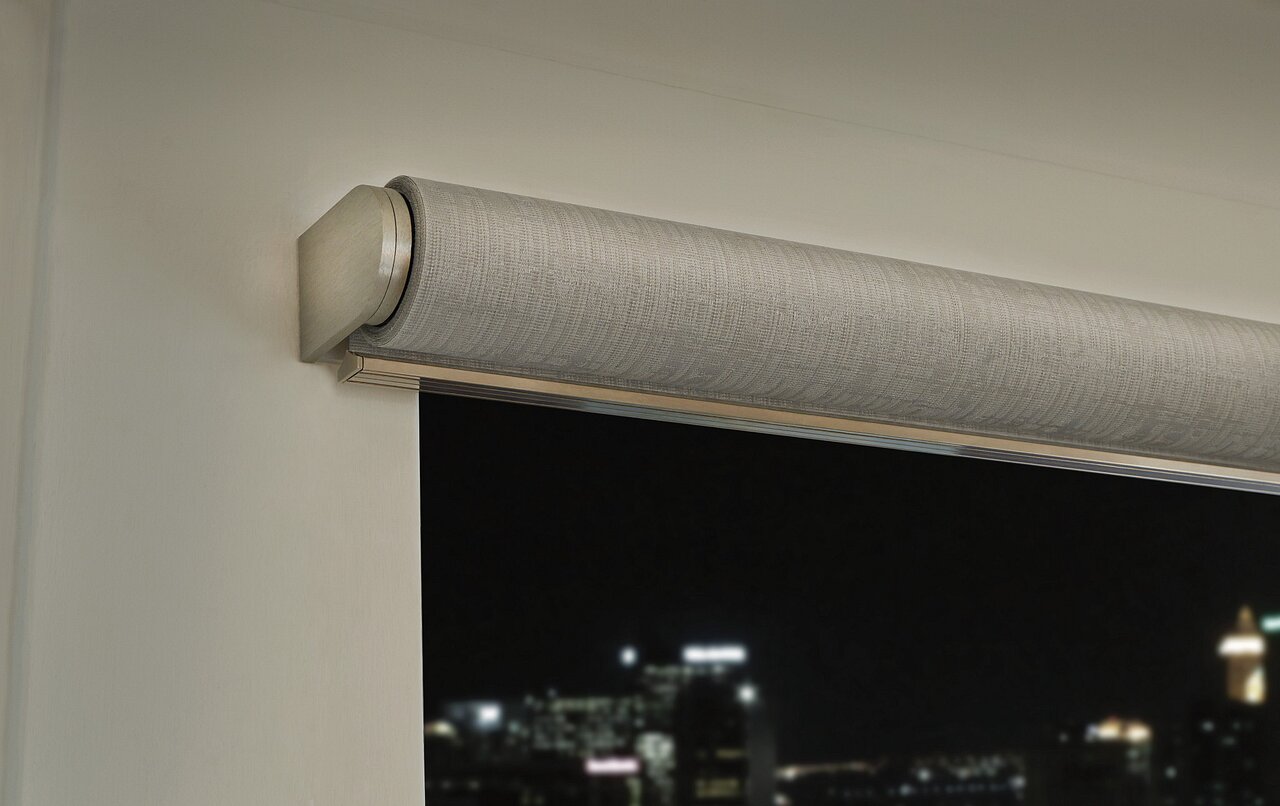 Lutron Palladiom roller shade with architectural hardware in a dining room